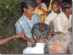 Ramesh helping prepare his mother's body