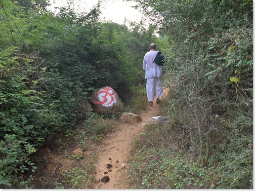 Om on the path, nearing the end
