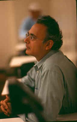 Dr. Luthar listening to a presentation